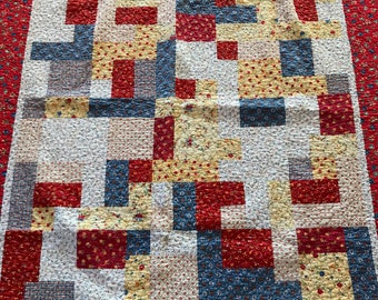 Small quilt, 50x58", patchwork coverlet, red yellow blue, calico fabrics, table covering, wall hanging, bright red border, blue backing