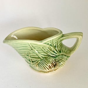 May include: A rustic wooden sign with the text "Welcome to our home" in white lettering. The sign features a distressed finish and a simple, inviting design, perfect for entryway decor.