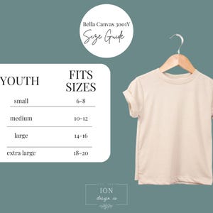 May include: A beige youth t-shirt hanging on a wooden hanger. The image includes a size guide with sizes ranging from small (6-8) to extra large (18-20). The text "Bella Canvas 3001Y Size Guide" is also present.