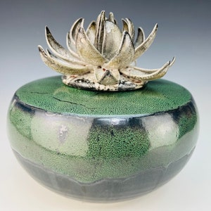 Medium cremation urn in green and black with lotus flower lid