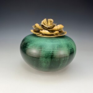 Handmade Cremation urn in green with porcelain flower