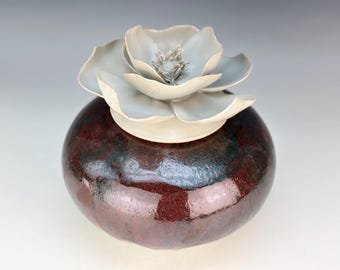 Porcelain urn in deep irradecent red and matte white