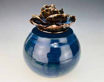 Medium blue cremation urn with rose lid