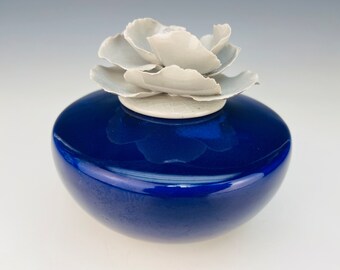 Small Cobalt blue cremation urn with white rose lid
