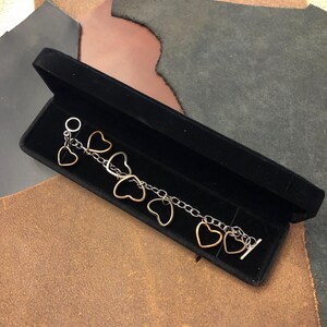 Charm Bracelet made from formed US Coin Hearts (Quarters, Nickels, Pennies, and Dimes) with OT toggle clasp closure.