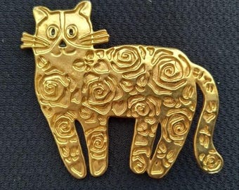 Broche vintage sin firmar de Lancôme Paris con diseño de rosa calada en tono dorado y forma de gato. Raro.