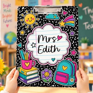 May include: A black clipboard with a white speckled pattern featuring a central cloud-shaped label with the text Mrs. Edith. The design includes colourful illustrations of a sun, a shooting star, a pencil cup with books, a flower, and a backpack.