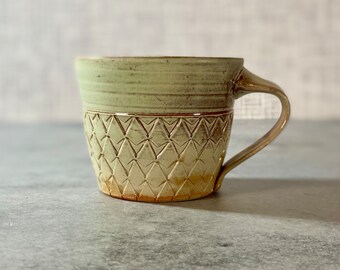 Soda fired pottery mug // handmade pottery mug with stamped pattern, ceramic mug with pale green pattern. One of a kind mug 11 ounces