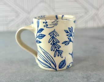 Blue and white pottery mug // white porcelain mug with blue floral and leaves patterns, coffee lover's gift, blue and white patterned