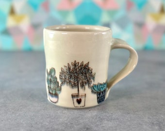 Houseplant pottery mug // white porcelain mug with plants, planters, snake plant and cactus plants. Hand-painted houseplants on ceramic mug