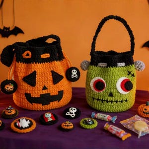 May include: Two crocheted Halloween treat bags: an orange pumpkin and a green Frankenstein's monster. The pumpkin bag has a black face and handle. The Frankenstein bag has large eyes and a black handle. Several crocheted Halloween-themed candies and treats are also visible.