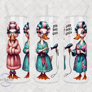 May include: A white 20 oz tumbler featuring a cartoon duck in curlers and a robe. The duck is depicted in various poses, holding a coffee cup and a hairdryer. The text "Zero Ducks Given" is also displayed on the tumbler.