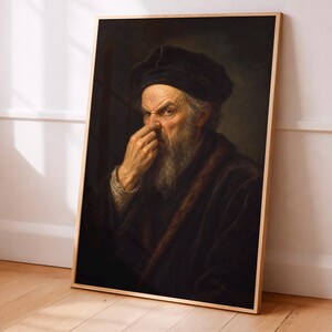 May include: A framed portrait of an elderly man with a long white beard and a black hat. The man is depicted in a dark, somber color palette, with a focused expression, touching his nose. The artwork is displayed on a wooden floor.