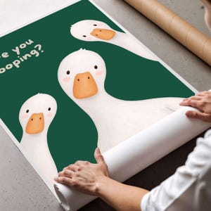May include: A poster featuring three white geese with orange beaks and pink cheeks against a dark green background. The text "Are you pooping?" is printed in white in the upper left corner. The geese have simple black eyes and rounded heads.