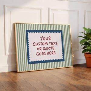 May include: A rectangular framed print featuring a green and white vertical striped background. In the centre, a white postage stamp-shaped graphic with a dark blue border contains the maroon text: YOUR CUSTOM TEXT, OR QUOTE GOES HERE.