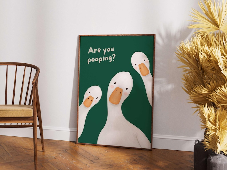 May include: A rectangular wall art print featuring three white ducks with orange beaks against a solid dark green background. The text "Are you pooping?" is printed in a light-colored, rounded font in the upper left corner of the artwork.