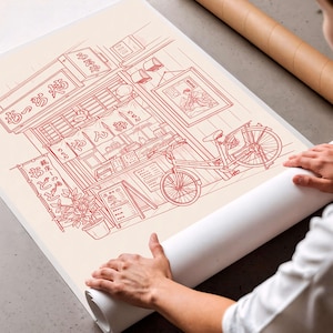 May include: A red line drawing of a Japanese ramen shop with a bicycle parked outside. The shop has Japanese text on the sign and a menu board. The artwork is on a cream-colored paper.