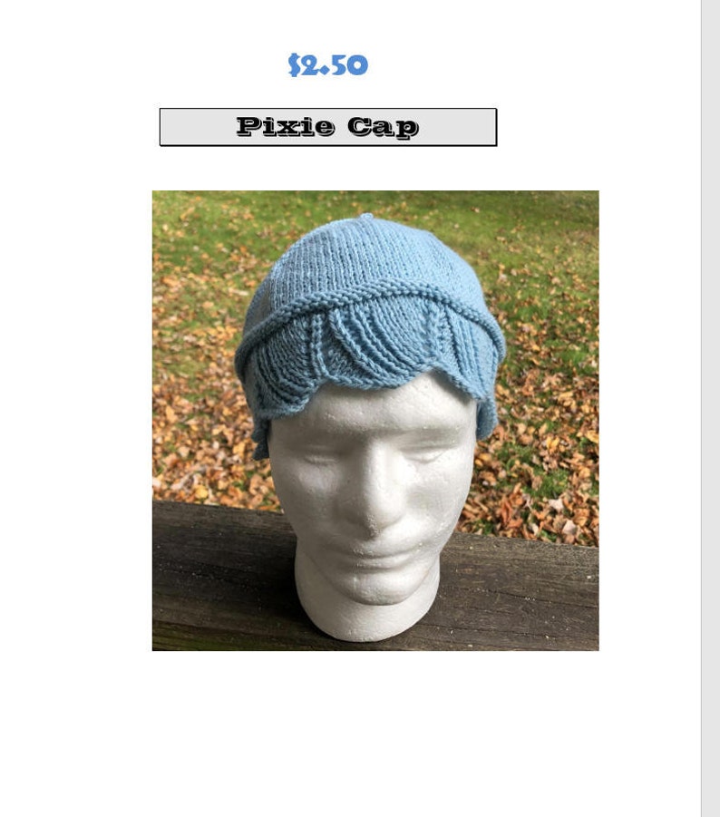 May include: A light blue knitted pixie cap with a scalloped edge. The cap is on a white mannequin head.