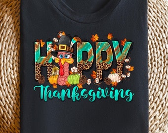 May include: Black t-shirt with a turquoise and brown graphic of a turkey with the text "Happy Thanksgiving" on it.