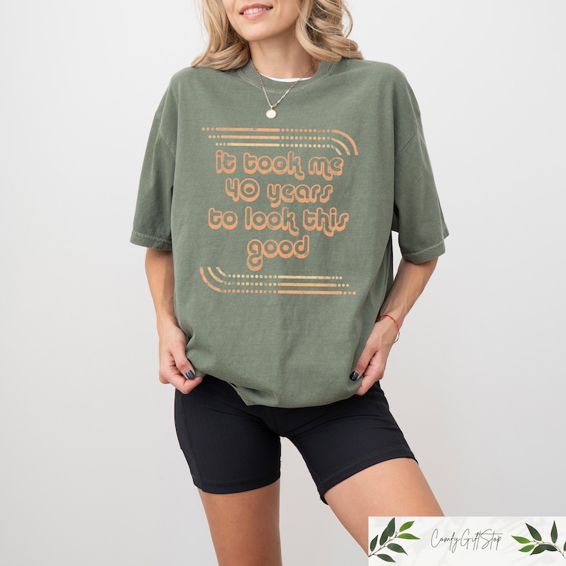 May include: A green t-shirt with the text "It took me 40 years to look this good" in a retro font.