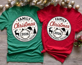 May include: A green and a red short-sleeved t-shirt, each featuring a circular graphic with the text "FAMILY Christmas" in black and red, "2026" inside a Christmas ornament with a Santa hat, a reindeer, a pine tree, and "MAKING MEMORIES TOGETHER".