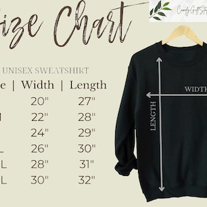 May include: Size chart for a unisex sweatshirt. The chart shows the width and length in inches for sizes S, M, L, XL, 2XL, and 3XL. A black sweatshirt is shown with the width and length measurements marked.