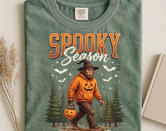 Comfort Colors® Spooky Season Bigfoot Shirt, Pumpkin Bigfoot Graphic Shirt, Fall Camping Shirt Gift, Funny Sasquatch Halloween Ghost Tee