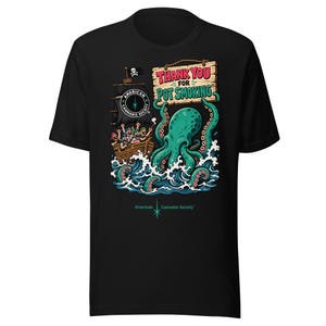 May include: A black t-shirt featuring a graphic of a pirate ship and a large green octopus emerging from blue ocean waves. The octopus holds a wooden sign that reads THANK YOU FOR POT SMOKING. The ship displays an American Cannabis Society logo.