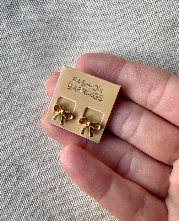 Tiny Gold Bow Stud Earrings - image 1