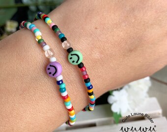 Colorful elastic bracelet made of glass beads and a rock crystal bead / rocailles / small beads / black / white / smiley