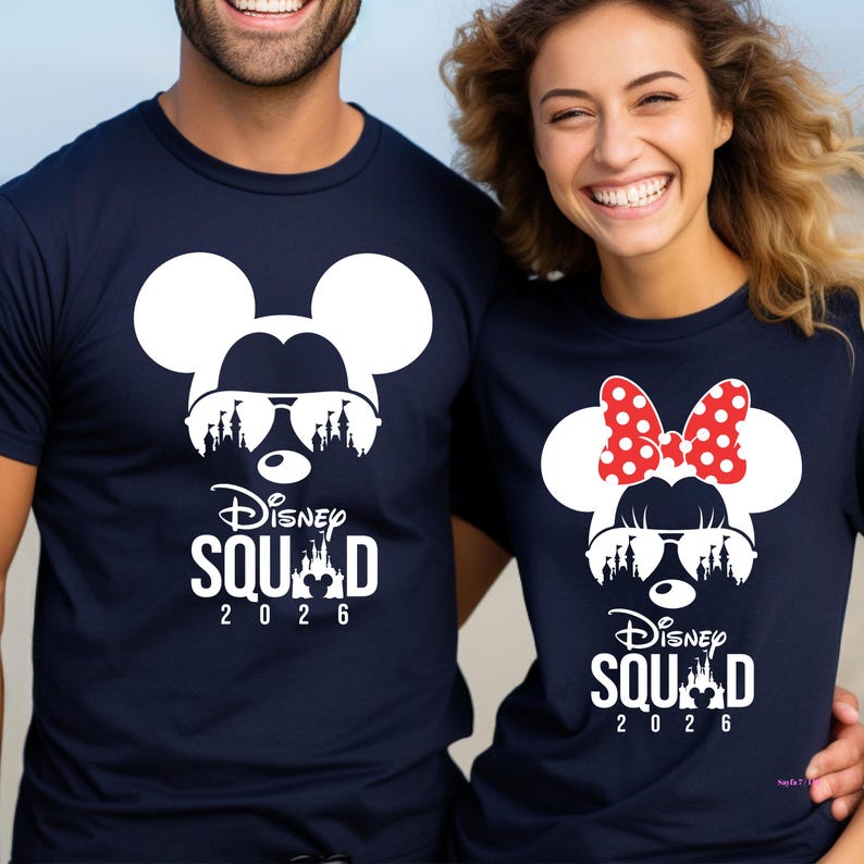 May include: Navy blue t-shirts featuring a white Mickey Mouse design wearing sunglasses and a castle silhouette. The text "Disney Squad 2026" is printed below the graphic. One shirt has a red polka dot bow.