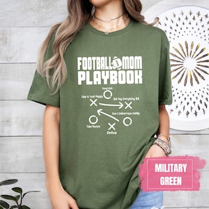 May include: A green t-shirt with the text "Football Mom Playbook" and a football play diagram. The text "Military Green" is in a pink box at the bottom of the image.