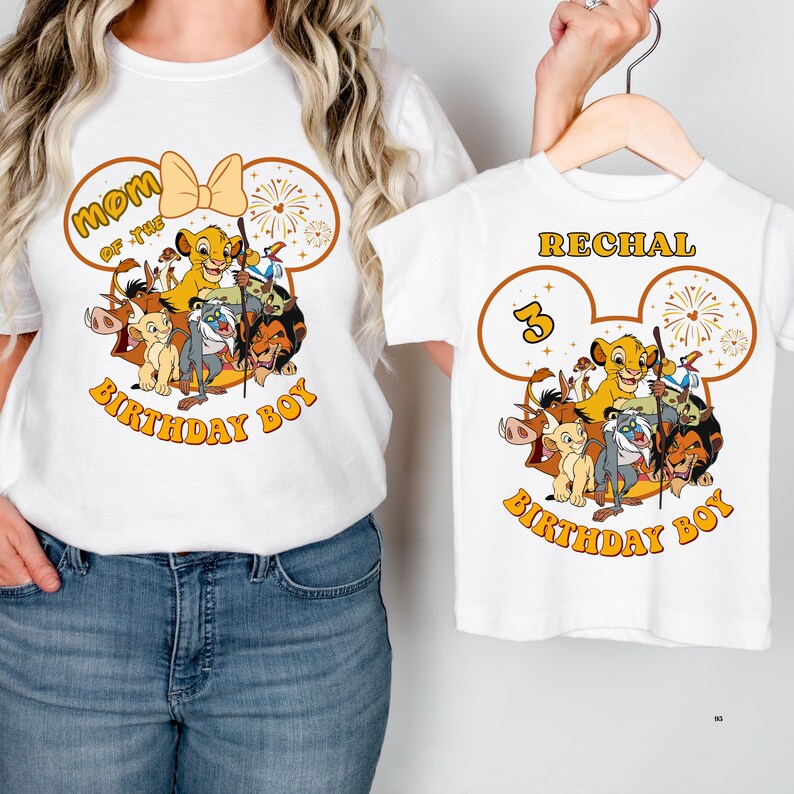 May include: White t-shirts with a Lion King theme. One shirt says "Mom of the Birthday Boy" and the other says "Rechal 3 Birthday Boy". Both shirts feature Simba and other characters from the movie.