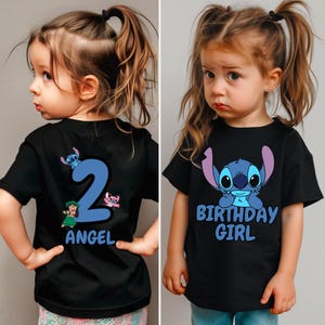 May include: Black t-shirt with a blue Stitch character and the text "Birthday Girl". The back of the shirt has a blue number 2 with two Stitch characters and the text "Angel".