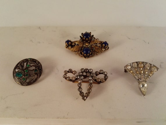 3 Antique C clasp costume brooches and one crystal