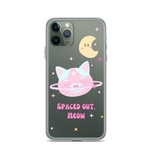 May include: A clear phone case with a pink and blue cat illustration, a yellow crescent moon, and the text "SPACED OUT. MEOW" on a dark green background.