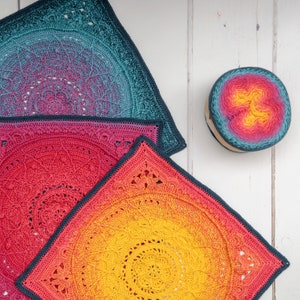 May include: Three crocheted squares in different sizes, with a gradient of colors from teal to pink to yellow. The squares are made with a circular pattern and have a textured, lacy look.