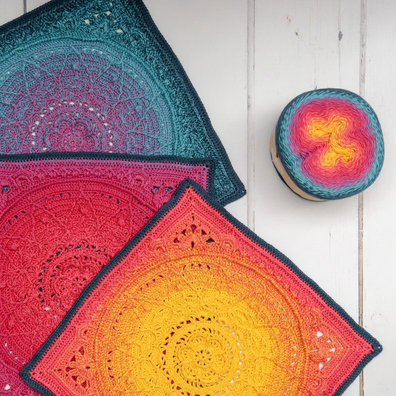 May include: Three crocheted squares in different sizes, with a gradient of colors from teal to pink to yellow. The squares are made with a circular pattern and have a textured, lacy look.