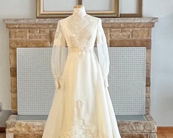 Alessandro 60's white wedding dress illusion sleeve chapel length train embroidered appliqué lace cuff detail sheer bib overlay