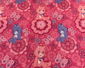 Care Bears pink and purple cotton fabric by 1/2 yd