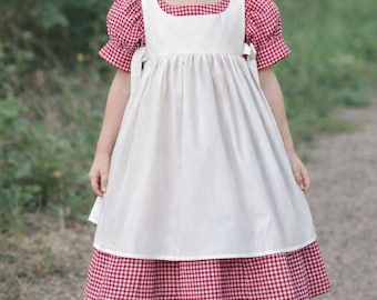 Girls classic white apron pinafore.