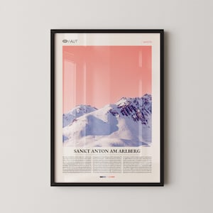 May include: Framed poster showing a snow-covered mountain range under a pink sky. The poster includes the text "Sankt Anton am Arlberg" and the country code "AUT". The poster is in a black frame.