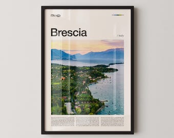 May include: Framed print featuring a scenic view of Brescia, Italy, with the city name in bold black letters. The image showcases a lake, mountains, and a coastal town, with a colorful sky. The print is in a black frame.