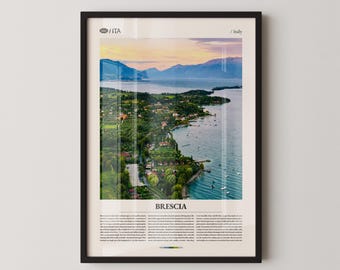 May include: Framed print featuring a scenic aerial view of Brescia, Italy, with a lake, mountains, and a coastal town. The image has a warm color palette with a sunset sky. The word "Brescia" is printed at the bottom.