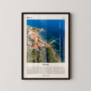 May include: Framed aerial photograph of Palau, Italy, showing a coastal town with red-tiled roofs, a lighthouse, and clear turquoise waters. The image is set against a bright blue sea and sky, with the word "PALAU" at the bottom.