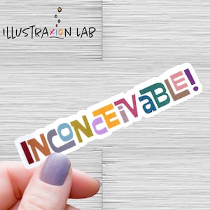 May include: A white sticker with the word "INCONCEIVABLE!" in colorful letters. The letters are in different colors, including red, orange, yellow, green, blue, purple, and brown.