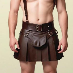 May include: A brown leather kilt with a belt and suspenders. The kilt has a pleated design and a flap pocket on the front.