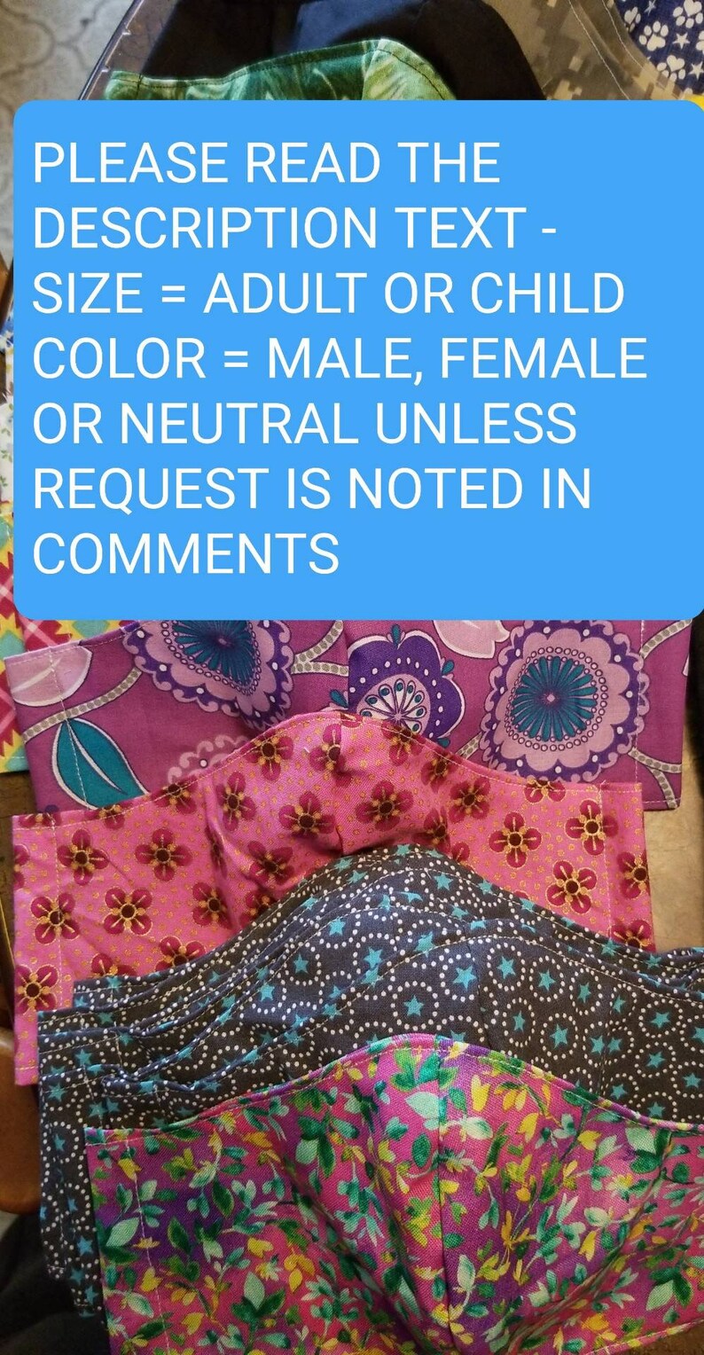 May include: A stack of colorful fabric face masks with floral and geometric patterns. The text on the blue background reads: "PLEASE READ THE DESCRIPTION TEXT - SIZE = ADULT OR CHILD COLOR = MALE, FEMALE OR NEUTRAL UNLESS REQUEST IS NOTED IN COMMENTS"