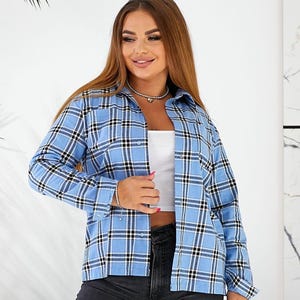 May include: A blue and white plaid long-sleeve shirt with a button-up front.