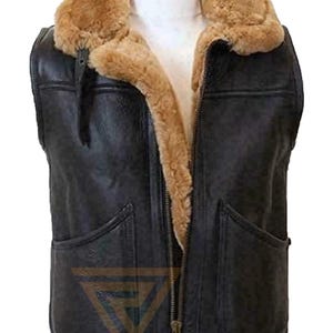 May include: A black leather vest with a brown shearling collar and lining. The vest has a zip fastening and two pockets.